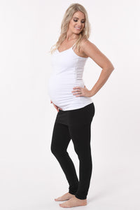 Pregnant woman wearing a skinny Skirt Maternity Yoga Pants Duo in black front