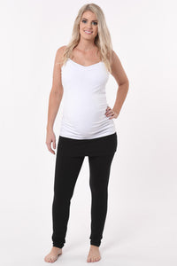 Pregnant woman wearing a skinny Skirt Maternity Yoga Pants Duo in black front view